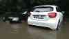 (Überflutungen) Autos stecken in Fluten nach Unwetter fest, Fäkalien in Garten: viel Regen in kurzer Zeit, Unterführung unter Wasser